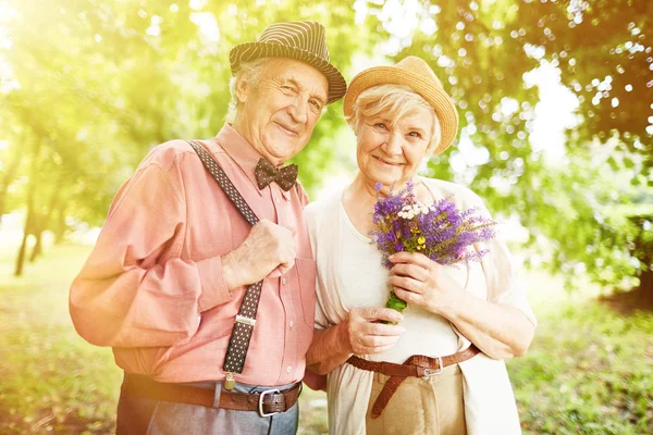 stock image elderly couple walking in park