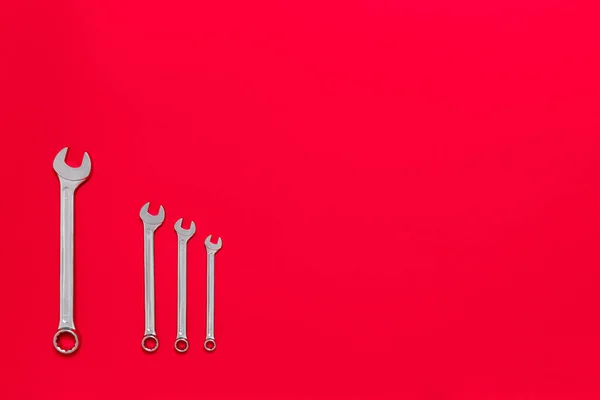 Four Metal Wrenches Different Sizes Isolated Red Background Copy Space — Stock Photo, Image