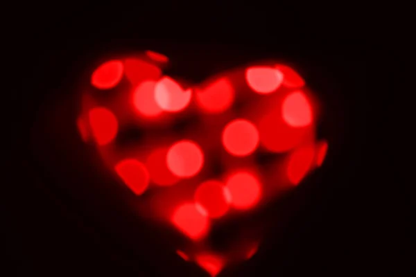 Θολή Κόκκινο Κύκλους Bokeh Σχήμα Καρδιάς Μαύρο Φόντο Ημέρα Του — Φωτογραφία Αρχείου