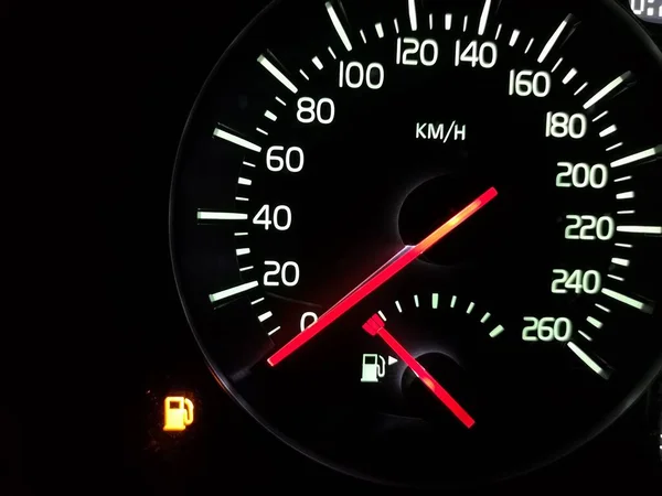 Empty tank. Speedometer with an arrow at zero. The fuel has run out. Crisis. A car does not go. Speed 0. Vehicle dashboard. Dial with a red arrow. Illuminated night device. Urgent refueling is needed.