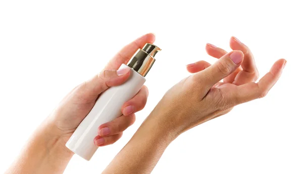 Środki kosmetyczne w ręce kobiety — Zdjęcie stockowe