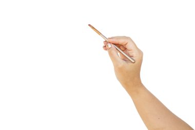 Fırça kozmetik tutan el