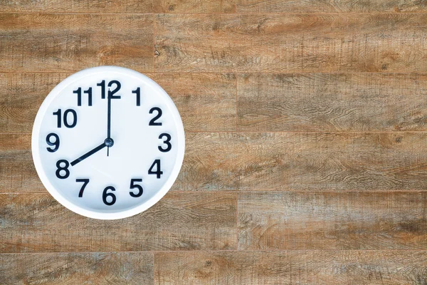 Clock on wood background