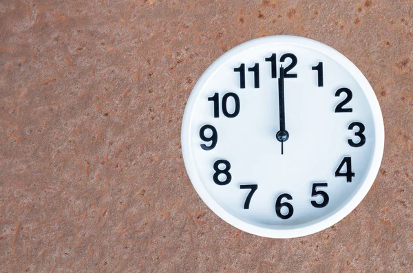 Clock on steel rusty background — Stock Photo, Image