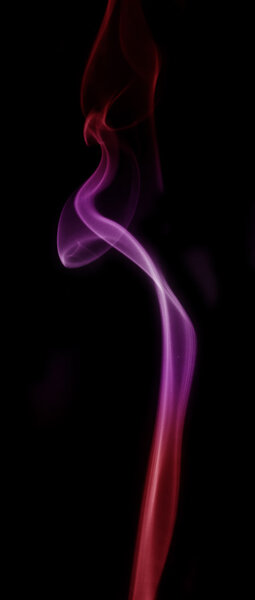 Smoke color red, pink and purple isolated on black background.