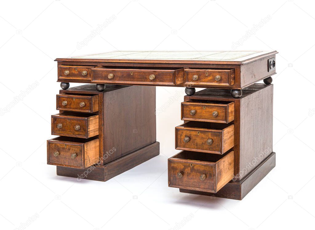 Old renovated desk with opened drawers and steel balls