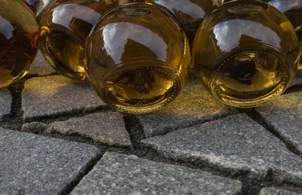 Wine bottles lying on the pavement — Stock Photo, Image