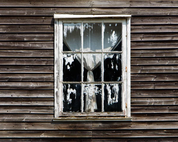 Old window with a curtain of wooden house — Stock Photo, Image