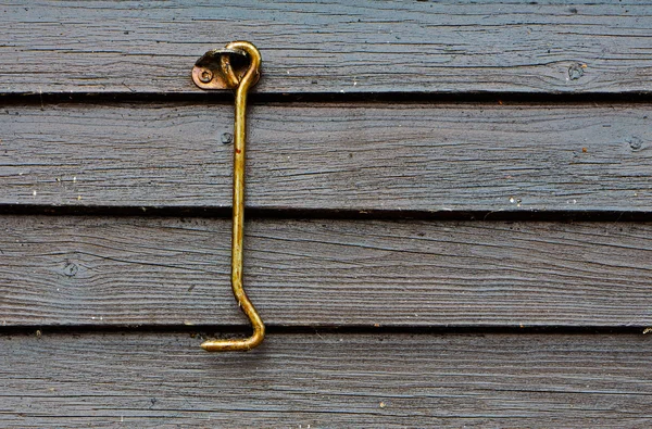 Drzwi hak w oleju na drewniane ściany — Zdjęcie stockowe
