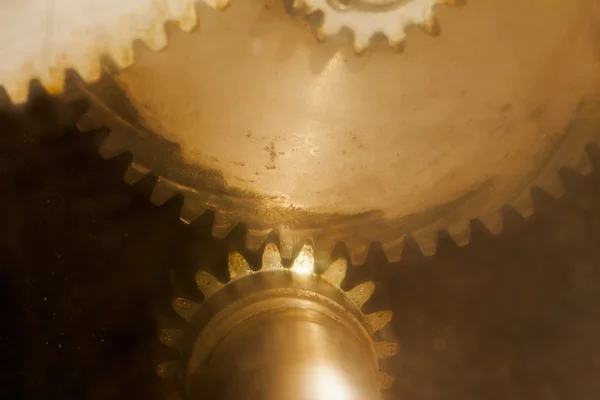 Old gears through scratched glass — Stock Photo, Image