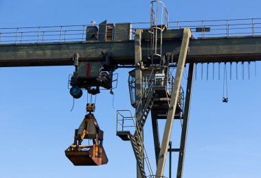 The gantry crane against  blue sky clipart