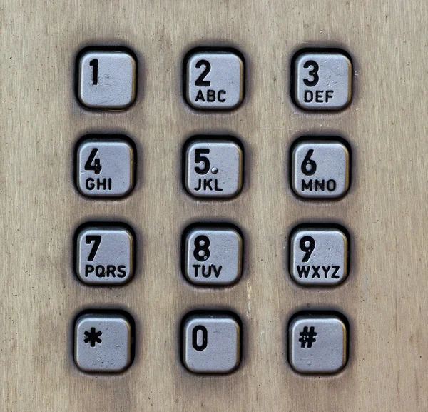 Botones metálicos de una cabina telefónica —  Fotos de Stock