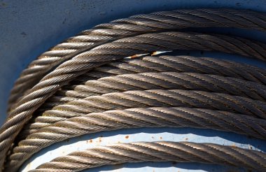 Steel cable on the reel in sunlight clipart