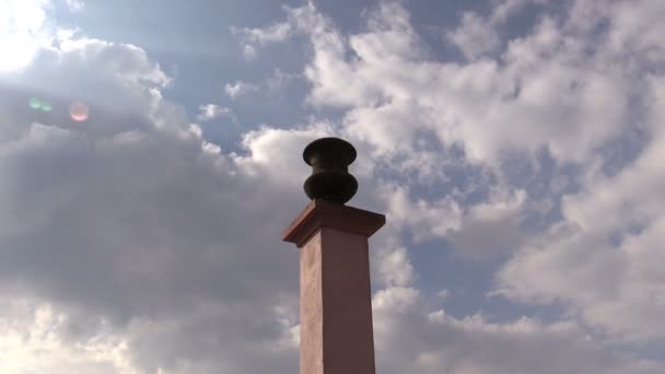Stone bowl on a pole against  sky — Stock Video