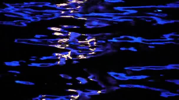 Water at night illuminated by electric lamp — Stock Video