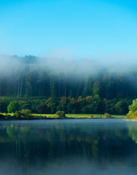 Morning fog over the river in sunshine — Stock Photo, Image