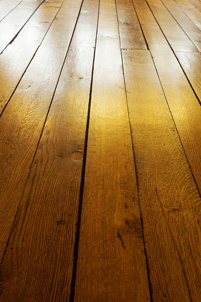 Old painted wooden floor in backlight — Stock Photo, Image