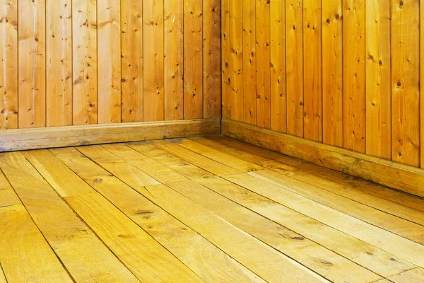Old varnished wooden floor and wall of  room — Stock Photo, Image