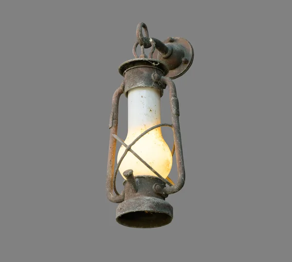 Масляная лампа старой шахты на сером фоне — стоковое фото