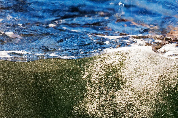 Water ocean wave through a glass window — Stock Photo, Image