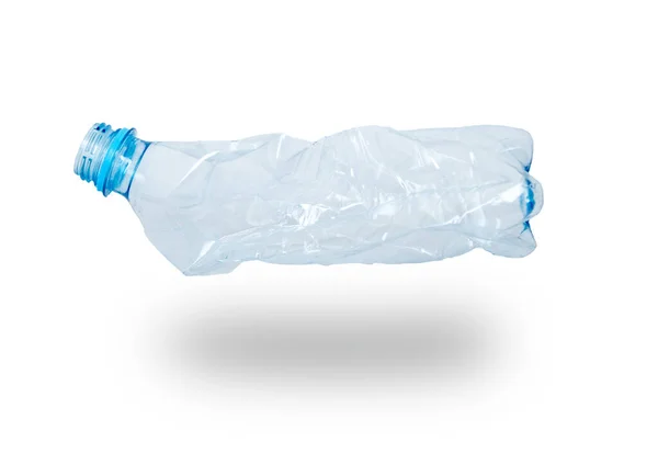 An empty smashed blue plastic bottle, isolated. On white background with shadow — Stock Photo, Image