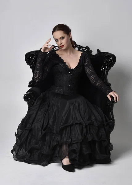 Full Length Portrait Woman Wearing Black Gothic Dress Sitting Ornate — Stock Photo, Image
