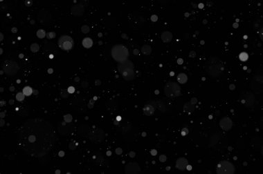 Siyah arkaplandaki Bokeh beyaz kar. Kar yağışı - yeni tasarım ögesi.