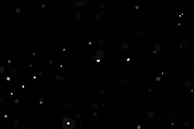 Siyah arkaplandaki Bokeh beyaz kar. Kar yağışı - yeni tasarım ögesi.