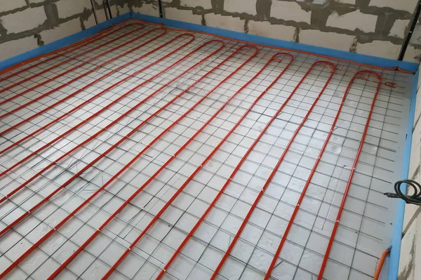 Installation of a heat-insulated floor, installation of water pipes, modern technology of heating of the house.new