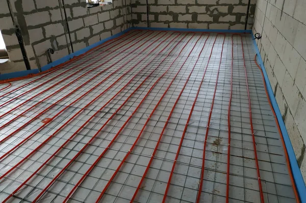 Installation of a heat-insulated floor, installation of water pipes, modern technology of heating of the house.new