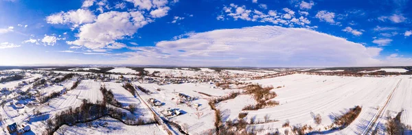Ukrainian village in winter, panorama of snow-covered village, view of the village from above, winter panorama. new