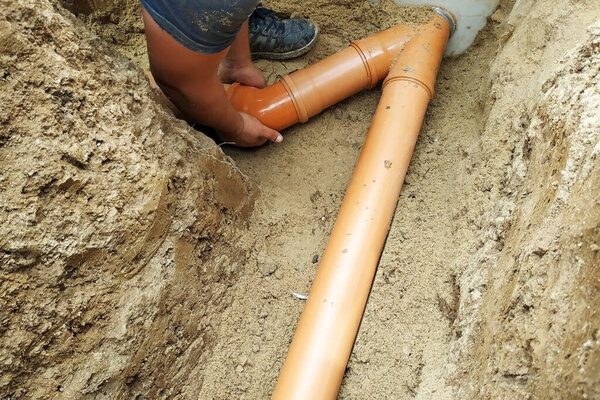 A locksmith supplies a sewer pipe to the sump. 2019