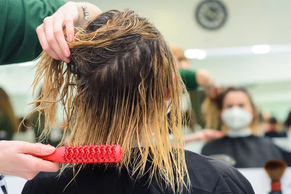 Combing wet hair, clean and washed head, preparation for a haircut. new