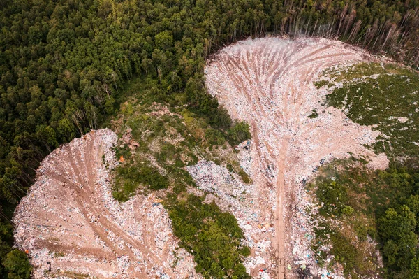 Destruction of forests and ecological system by garbage removal in forests, top view, destructive destruction of nature, landfill in Ukraine.