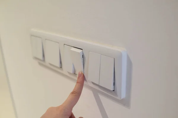Hand Turns Light Energy Saving Light Switch Finger Presses Button — Stock Photo, Image