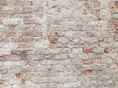 Kahverengi tuğla ve ufalanan alçı. Eski duvar dokusu