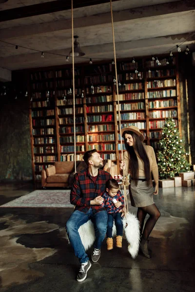 Happy Young Family Posing Home Swing — Stok Foto