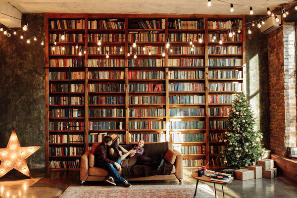 Happy young family posing at home