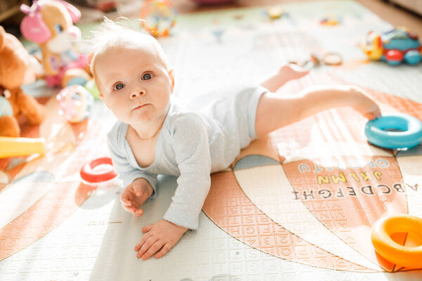 cute baby girl  playing on the floor