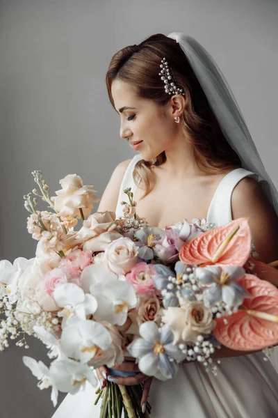 Delicate beautiful  young bride with flowers