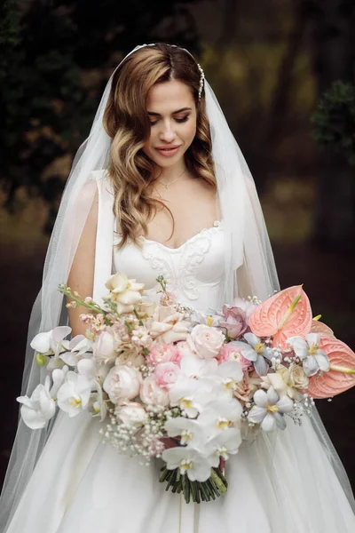 Delicate beautiful  young  bride with flowers