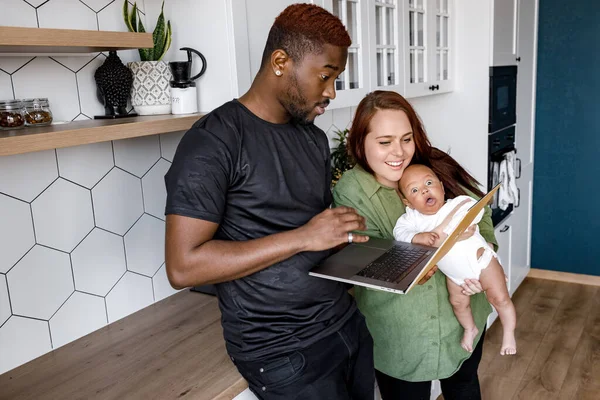 happy family with laptop at home