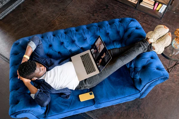 stock image young african  man having video call on  laptop 