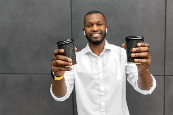 young african american man with coffee cups