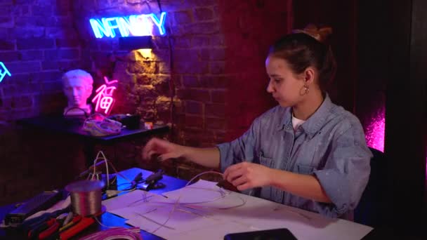 Young Beautiful Girl Makes Neon Signs Workshop Talented Artist Work — Stock Video
