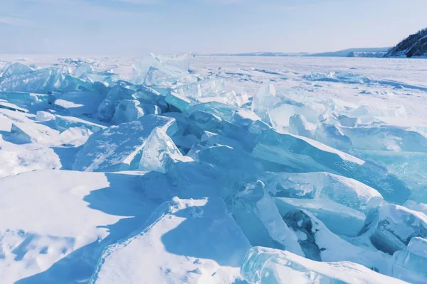 Splinters of broken ice on the Lake Baikal. Beautiful colored ice in Russia.