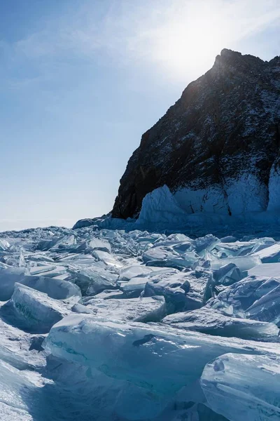 Splinters of broken ice on the Lake Baikal. Beautiful colored ice in Russia.