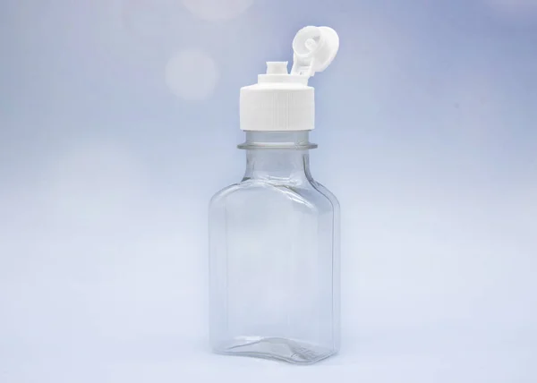Przezroczyste Puste Butelki Kosmetyczne Słoiki Miękkim Niebieskim Tle — Zdjęcie stockowe
