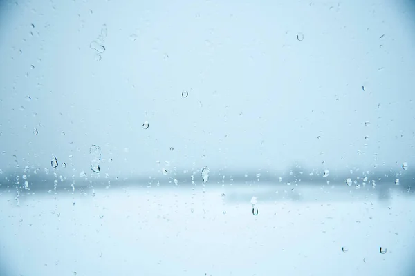 Abstrakter Verschwommener Hintergrund Autoscheibe Mit Wassertropfen Aus Schmelzendem Schnee — Stockfoto