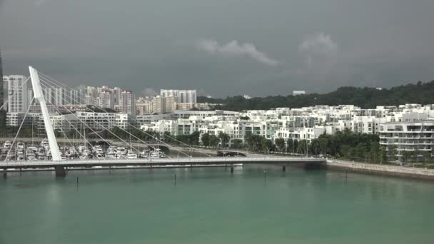 A cruise ship goes to the open sea from the seaport of a large city — Stock Video